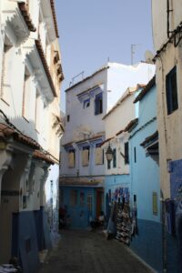 Explore the picturesque blue alleyways of Chefchaouen, Morocco, capturing its enchanting charm.